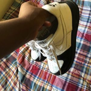 Air Force 1- Black and White with golden “AF1” tag